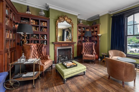 York House distinguished Library Bar with wingback leather arm chairs and gas fireplace