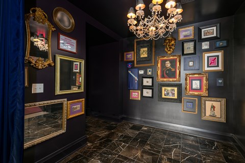 York House decorative lobby with eclectic framed art and vintage chandelier