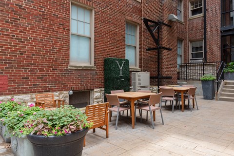 York House quaint courtyard with communal seating and grilling station