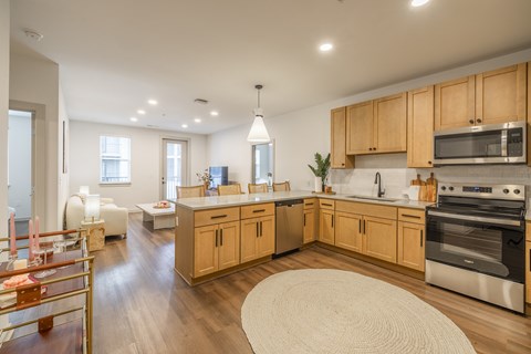 A kitchen with wooden cabinets and stainless steel appliances.