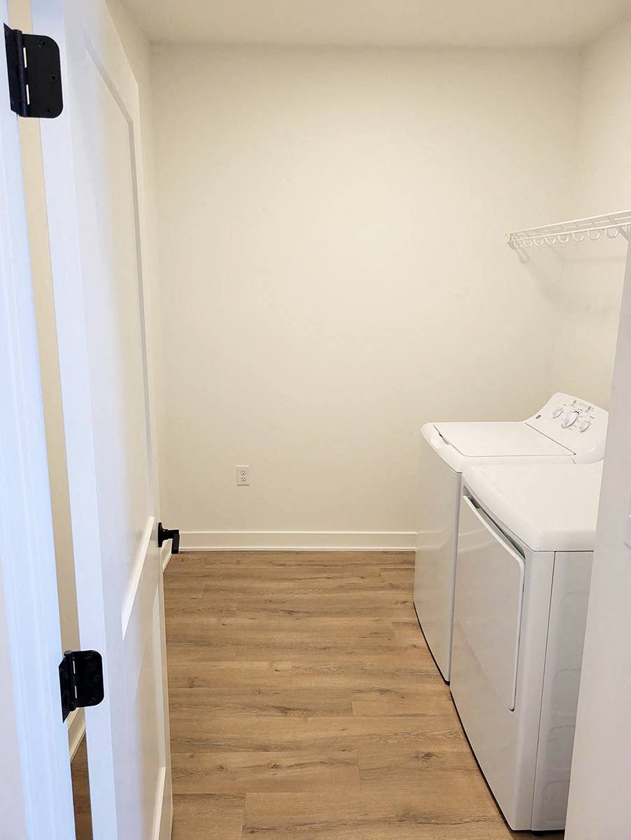 a small laundry room with a washer and dryer
