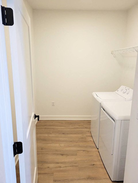 a small laundry room with a washer and dryer
