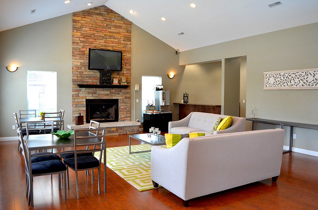 white couch, brick firplace, wall-mounted TV at Villas At Crystal Lake, Swansea, IL, 62226