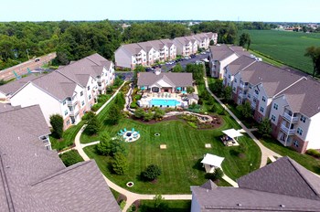 drone shot of 7 buidlings, clubhouse, and pool - Photo Gallery 2