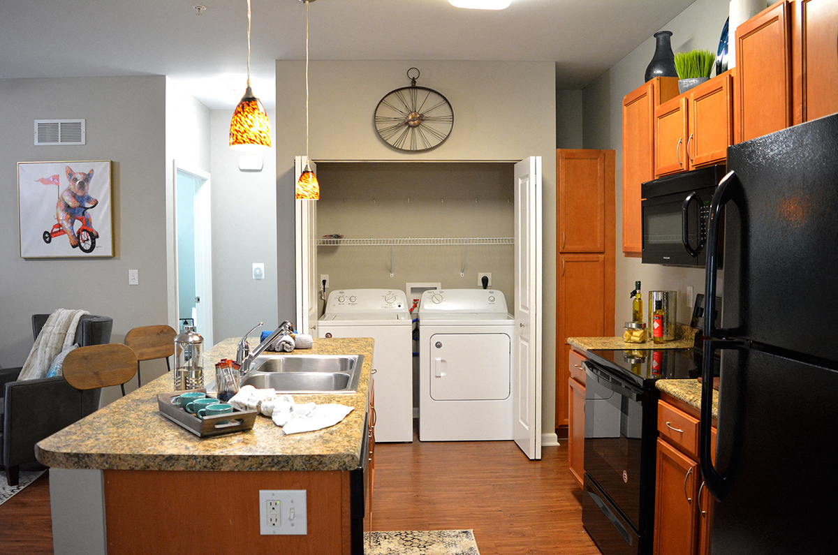kitchen with island and laundry closet at Villas At Crystal Lake, Swansea, 62226