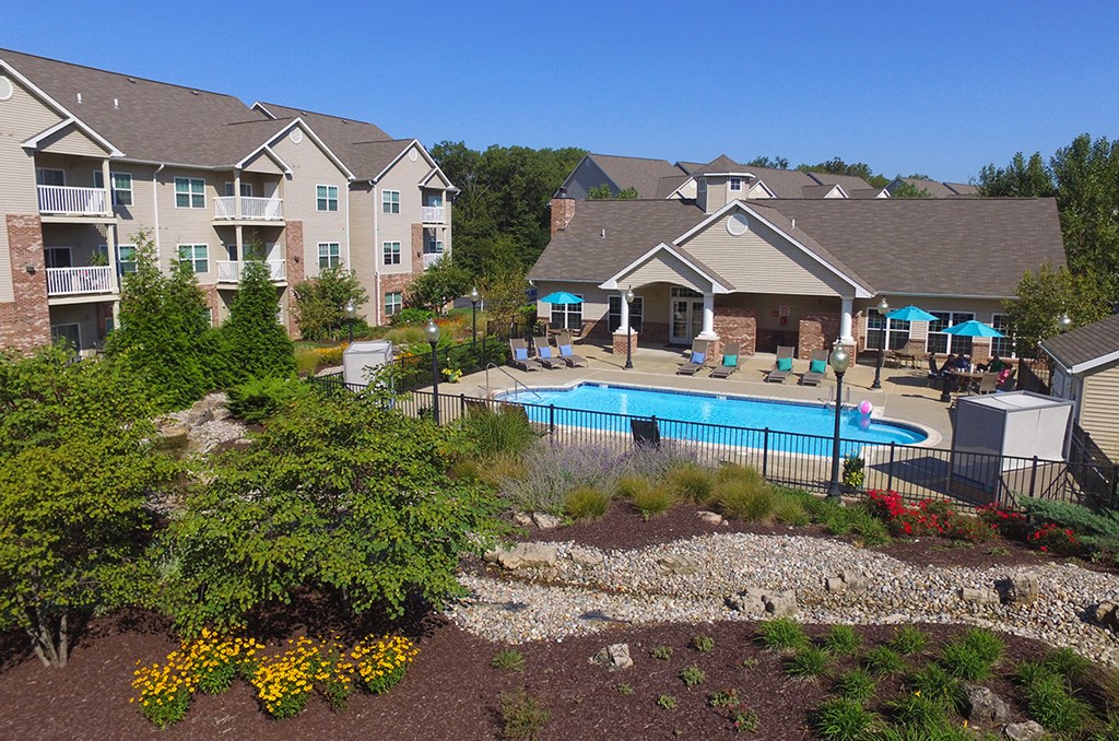 exterior photo of tree and pool at Villas At Crystal Lake, Swansea, Illinois