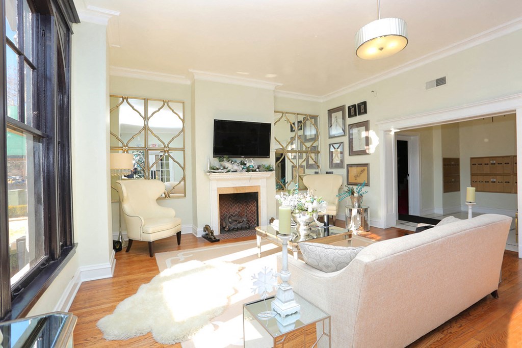 York House drawing room with seating and TV at York House, Saint Louis, MO, 63108