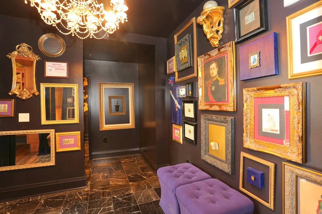 York House library bar decor, dark wall with artwork at York House, Saint Louis, MO