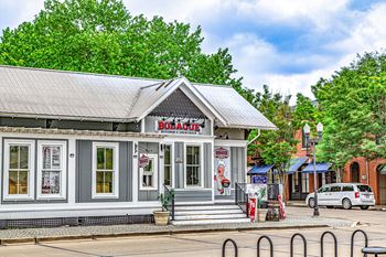 A small building with a red sign that says "BOARD" on it.