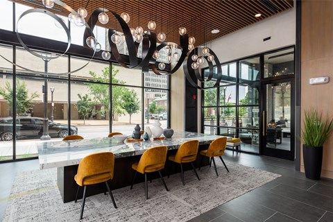 Contemporary lobby with marble dining table at Bemiston Place Apartments, Missouri, 63105