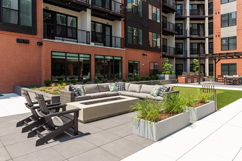 Resident courtyard with fire pit and conversational seating  at Chapter at the Streets of St Charles, Saint Charles, Missouri