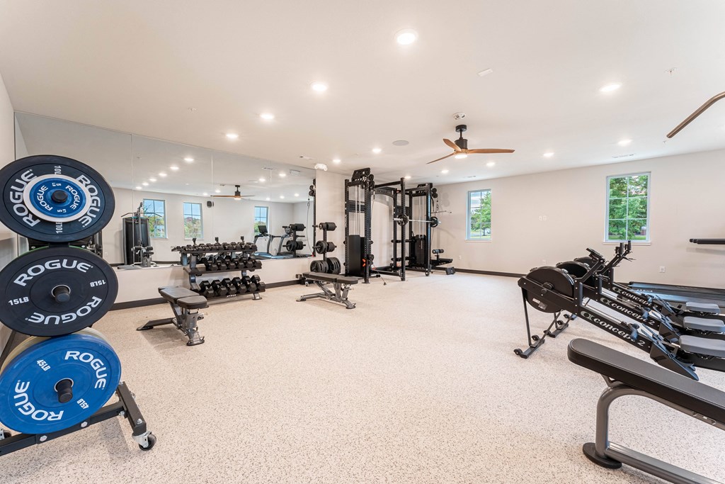 fitness center with free weights, strength training and cardio equipment at Pure Lowell, Lowell