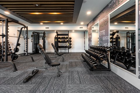 Large modern fitness center with free weights  at Chapter at the Streets of St Charles, Saint Charles, MO