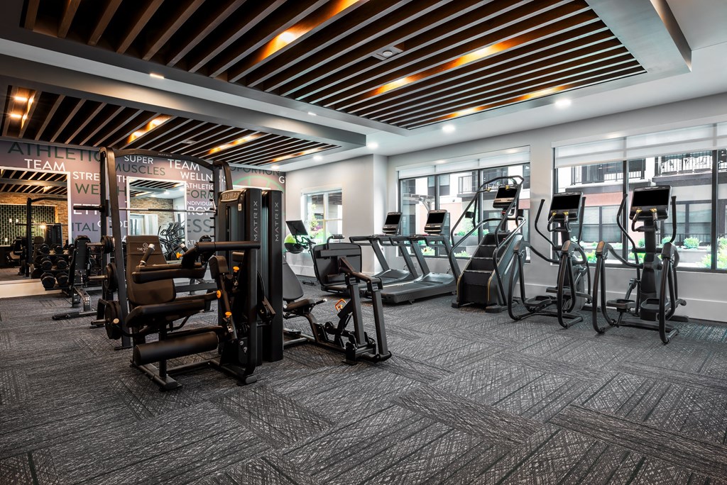 Large modern fitness center with cardio equipment and strength training machines  at Chapter at the Streets of St Charles, Saint Charles, MO, 63303