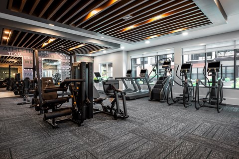Large modern fitness center with cardio equipment and strength training machines  at Chapter at the Streets of St Charles, Saint Charles, MO, 63303