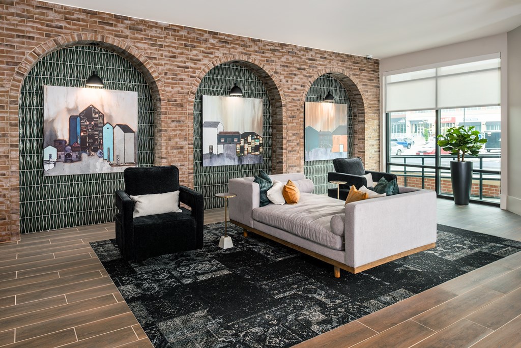 Modern resident lounge with chase lounge and arm chairs  at Chapter at the Streets of St Charles, Saint Charles, 63303