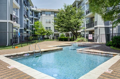 Resort style swimming pool with sundeck at The Landing Apartments, St. Louis, Missouri