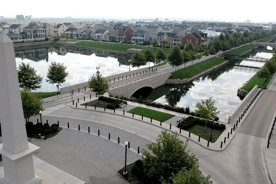 A view of a city from a high vantage point with a river running through it.