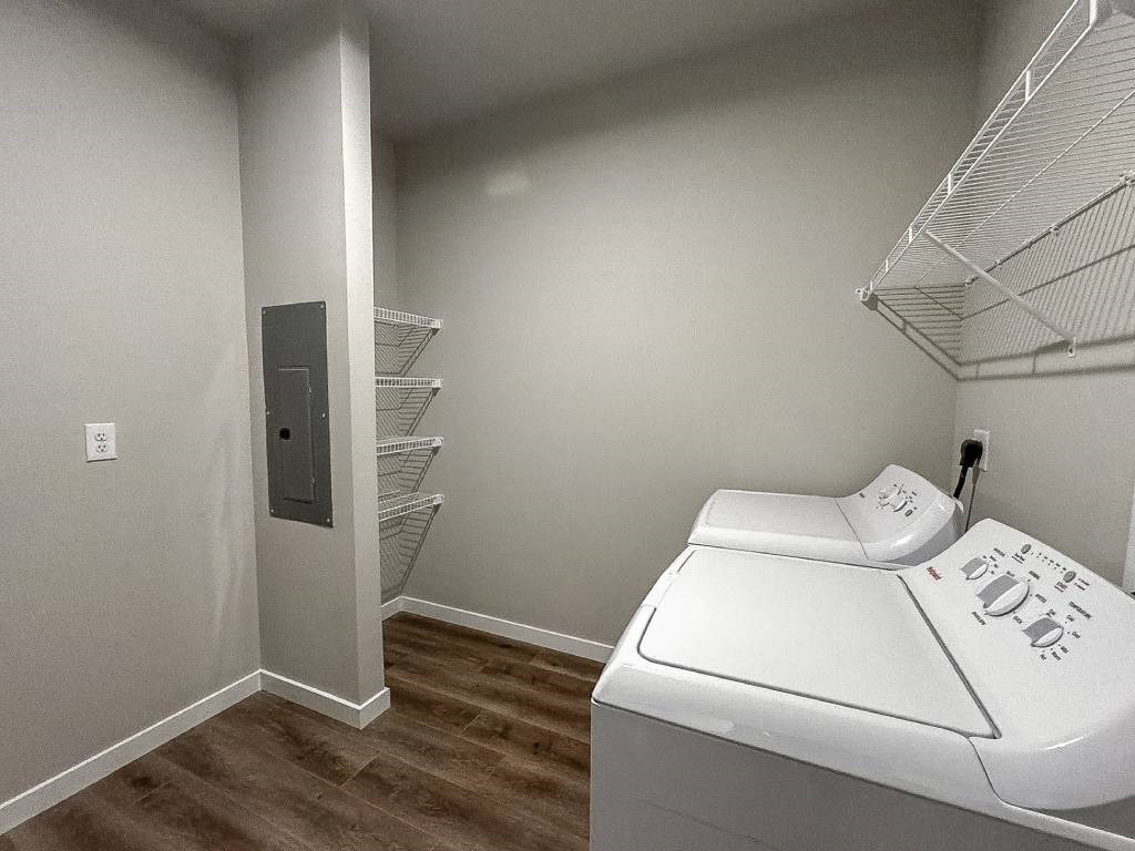 A laundry room with a washer and dryer.