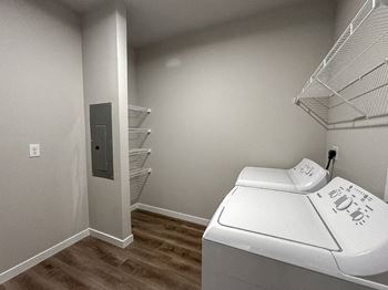 A laundry room with a washer and dryer.