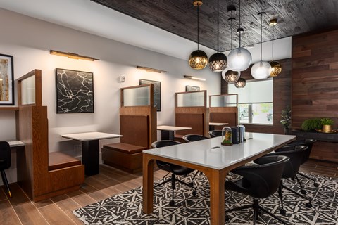 Resident lounge with individual booths  at Chapter at the Streets of St Charles, Saint Charles, Missouri