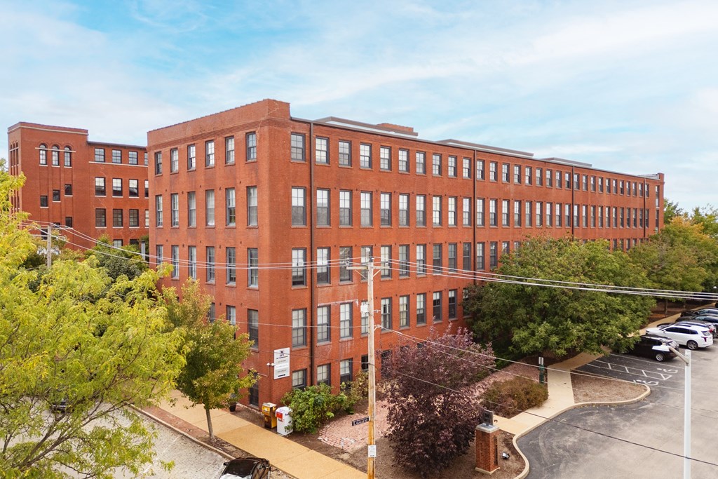 an overhead view of a large brick building with many windows at Lofts at Lafayette Square Apartments, Saint Louis, MO, 63104