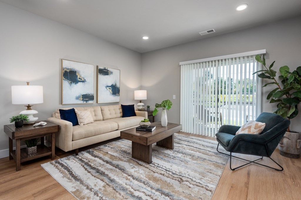 a living room with a couch and a chair