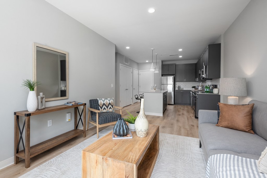 a living room with a couch and a coffee table at The Edwin on Grand Apartments, Missouri, 63103