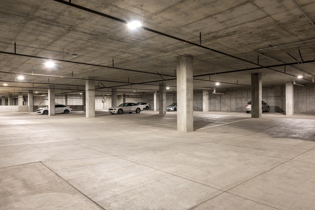 an empty parking garage with cars parked in it at The Edwin on Grand Apartments, St Louis, MO, 63103
