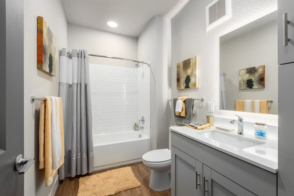 a bathroom with a shower toilet and sink at The Station St. Peters, St. Peters