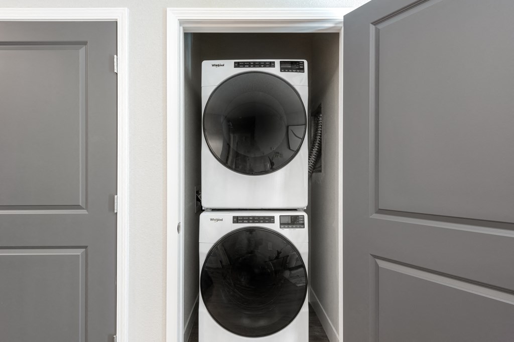 a front loading washer and dryer in a closet at The Station St. Peters, St. Peters Missouri