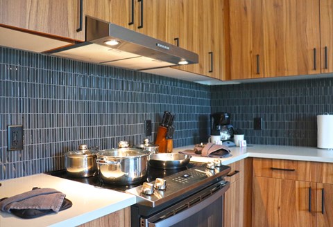 a kitchen with pots and pans on the stove