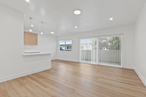A room with wooden floors and white walls.