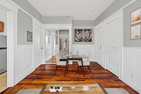 A kitchen with a table and chairs in the middle of the room.