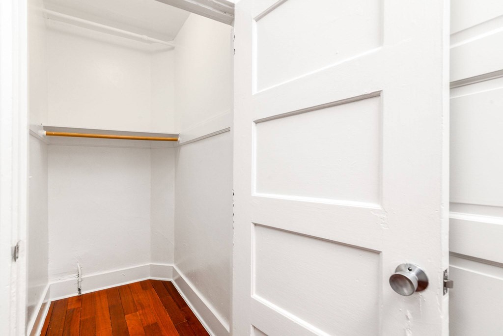 A white door with a silver handle is closed.