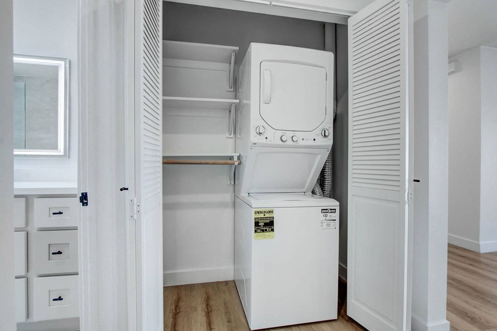 a laundry room with a washer and dryer in a closet