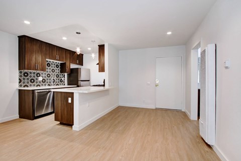 A kitchen with wooden cabinets and a white countertop.
