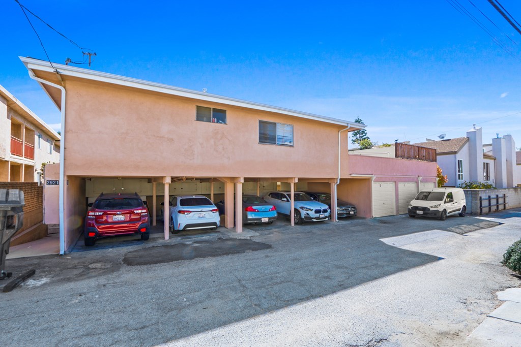 A building with a car parked in front of it.