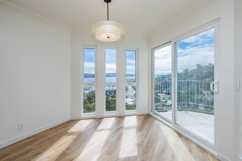 A room with a view of the city through the windows.
