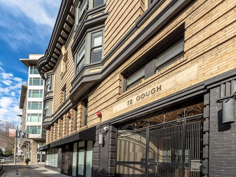 A building with a sign that says "72 Gough" on it.