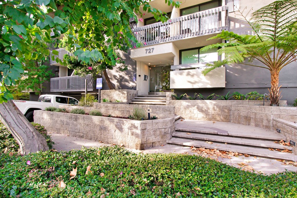the stairs up to the entrance of an apartment building