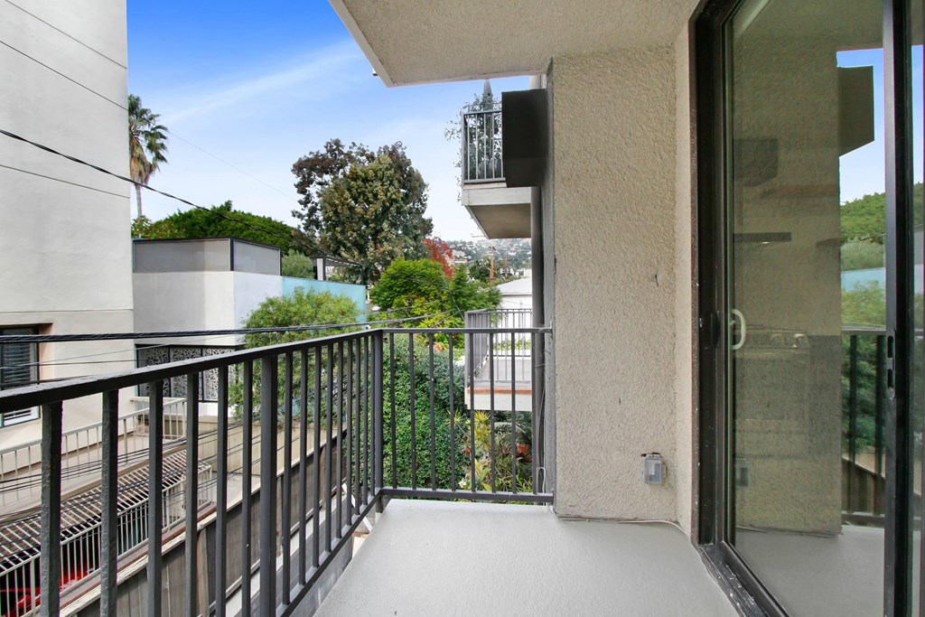 the view from the balcony of an apartment with a balcony railings and a balcony