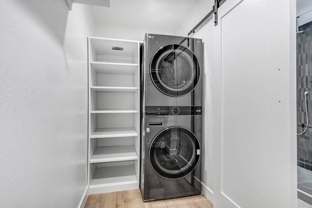 a small laundry room with a washing machine and a dryer