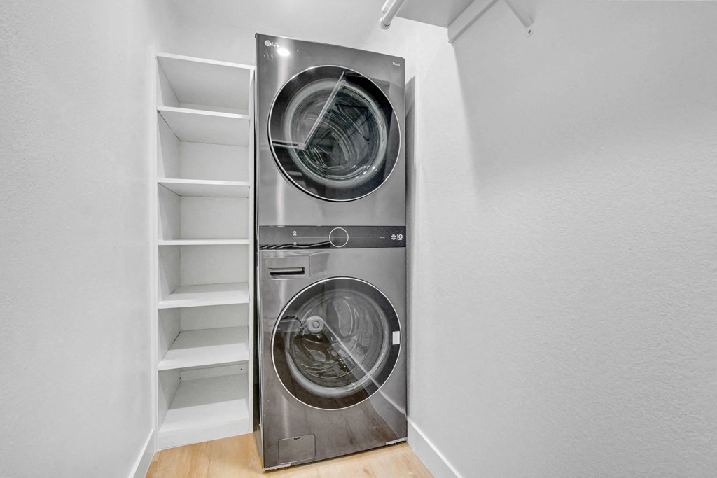 a small laundry room with a washing machine and a dryer