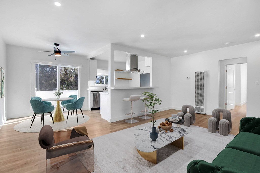 A modern living room with a brown chair and a green couch.