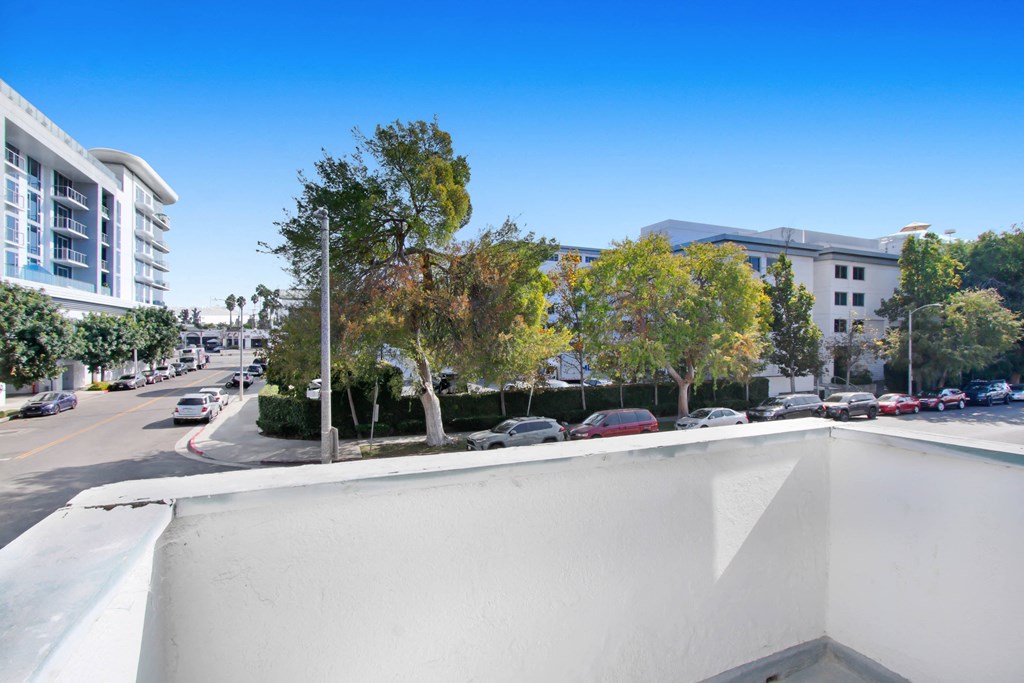 the view from the roof of a building overlooking a city street