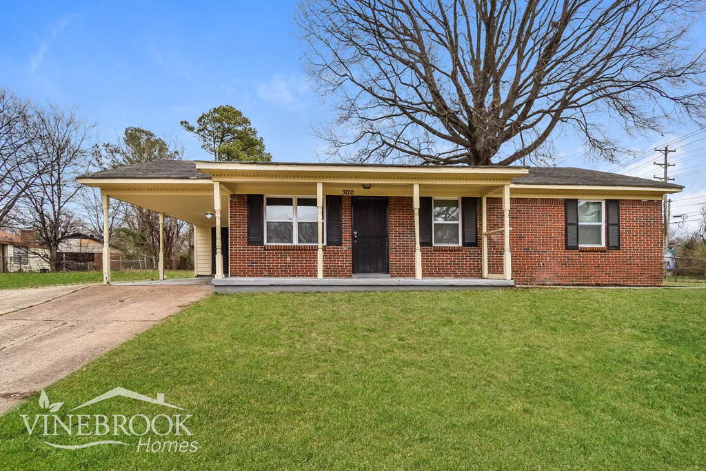 A house with a Vinebrook Homes sign in front.