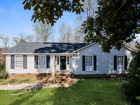 A house with a sign that says Vinebrook Homes.