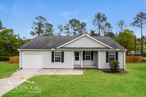 A house with a garage is for sale in Vinebrook Homes.