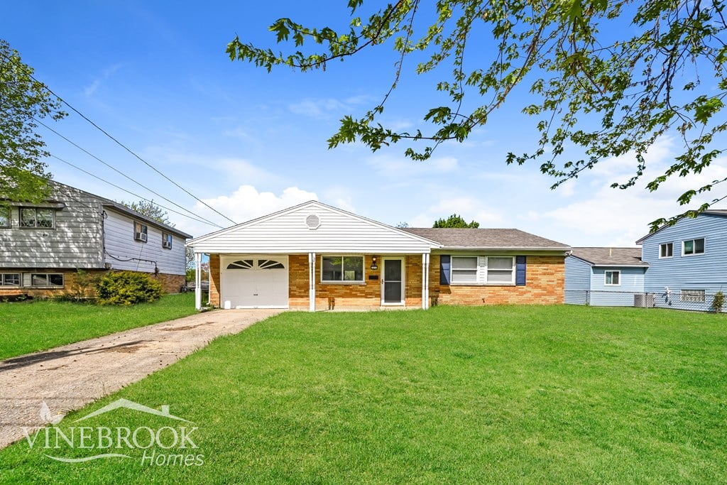 A house with a garage is for sale in Vinebrook Homes.